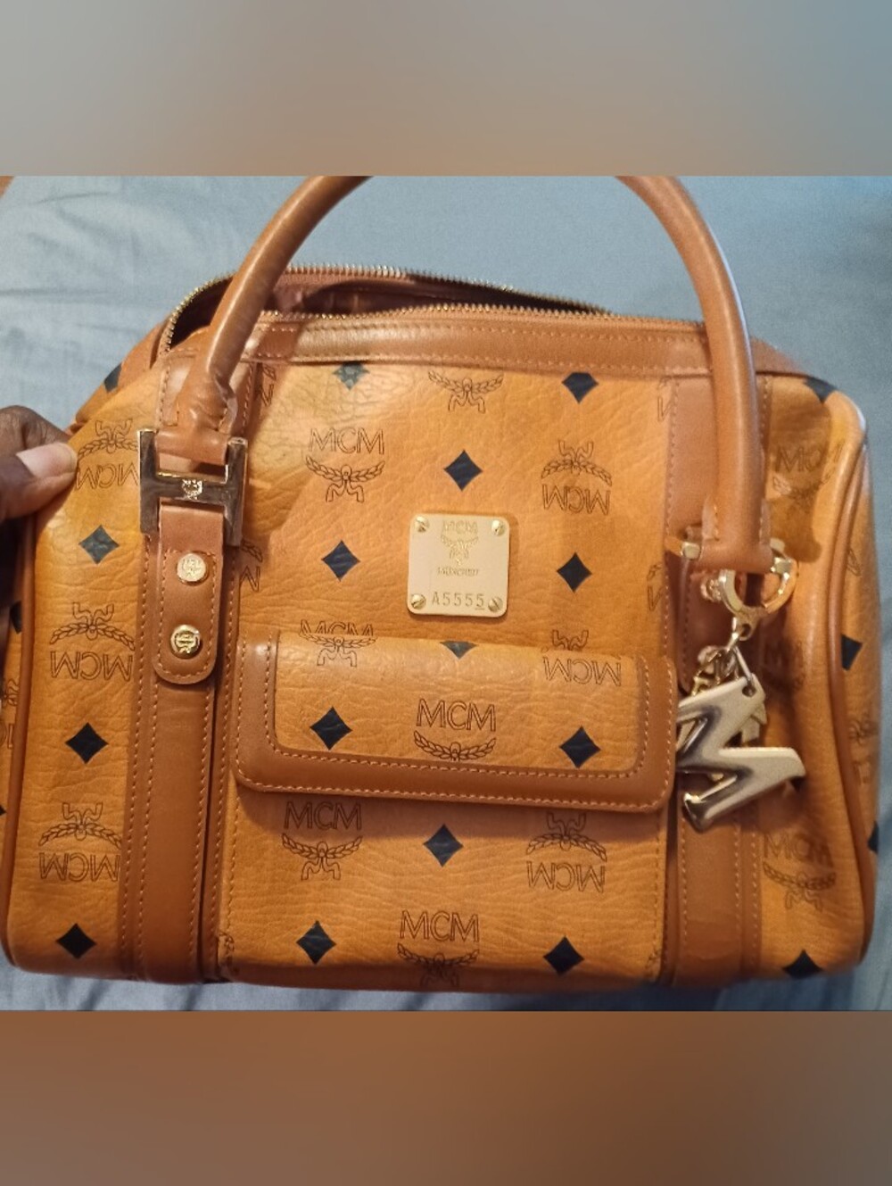 MCM Vintage Cognac visetose Boston Bag with mono pattern & gold mcm charms.